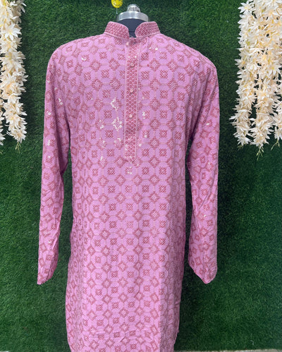 Chikankari embroidery, accented with shimmering sequins, creates a captivating blend of traditional craftsmanship and contemporary style.