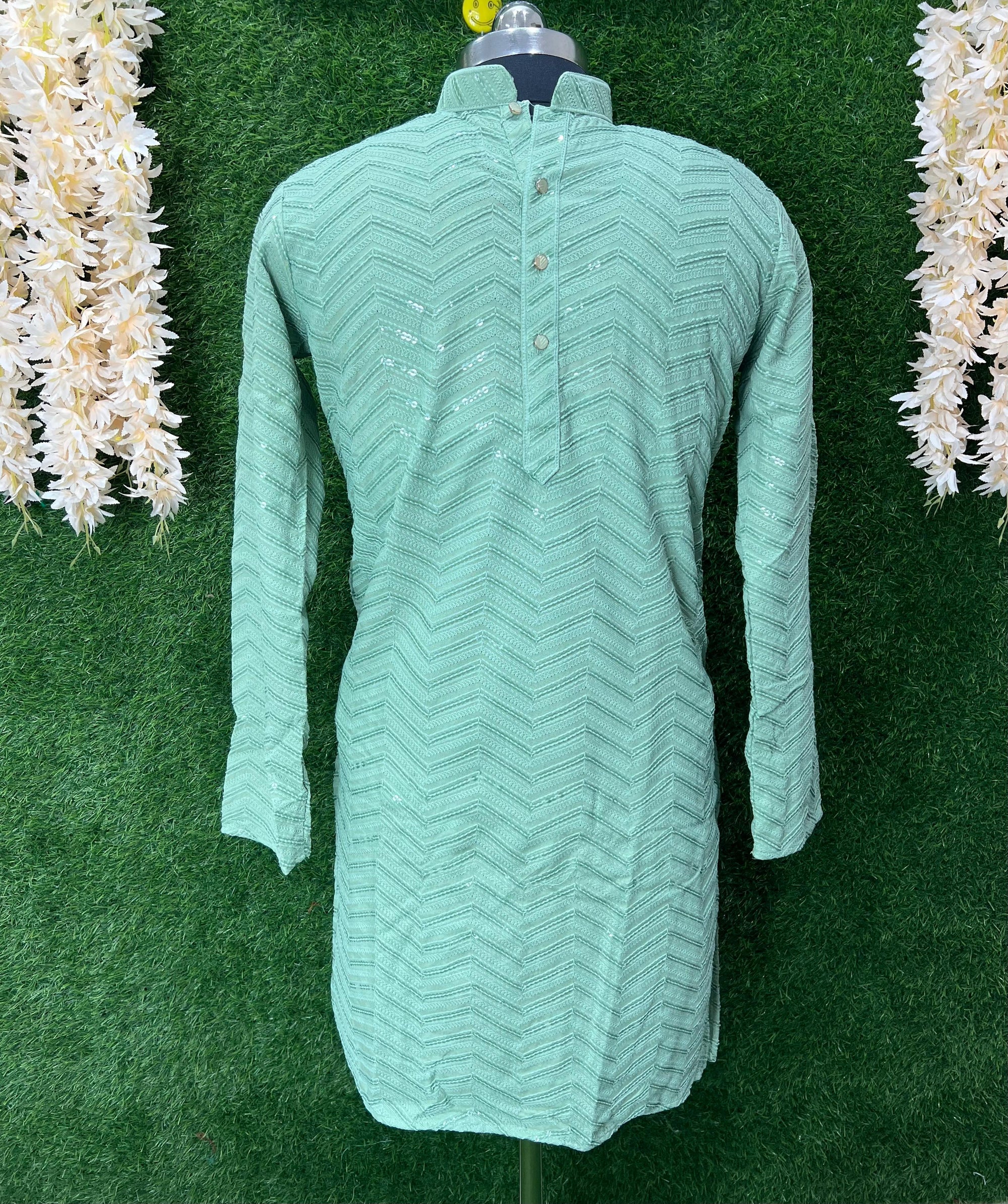 A blend of classic Lucknowi handwork and modern shimmer. This kurta set features intricate Chikankari embroidery highlighted with delicate sequins—perfect for weddings, Eid, or formal celebrations.