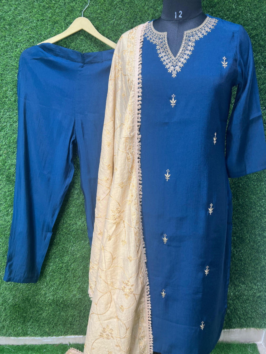 This traditional Indian outfit is perfect for any festive or formal occasion. The intricate golden embroidery on the kurta and dupatta adds a touch of elegance