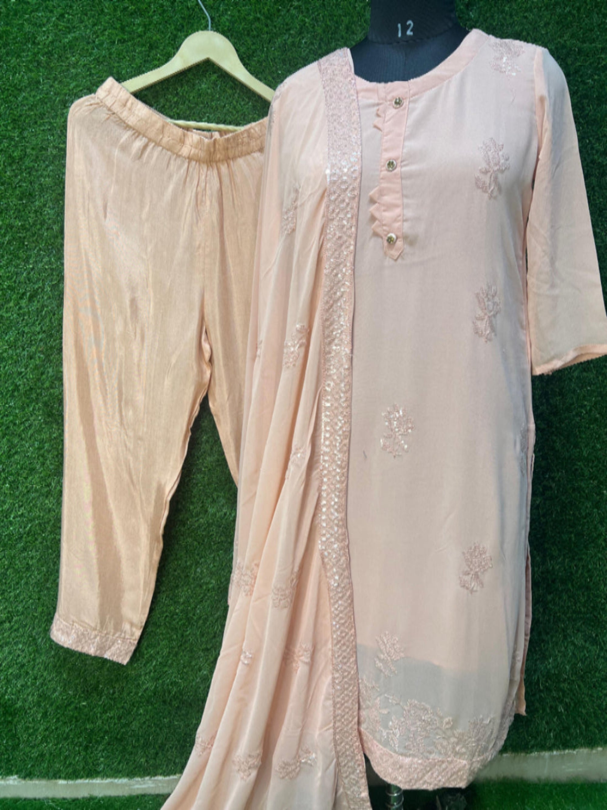 This traditional Indian ensemble is perfect for festive and formal occasions. The intricate golden embroidery on the kurta and dupatta exudes a refined elegance, adding a luxurious and timeless charm.