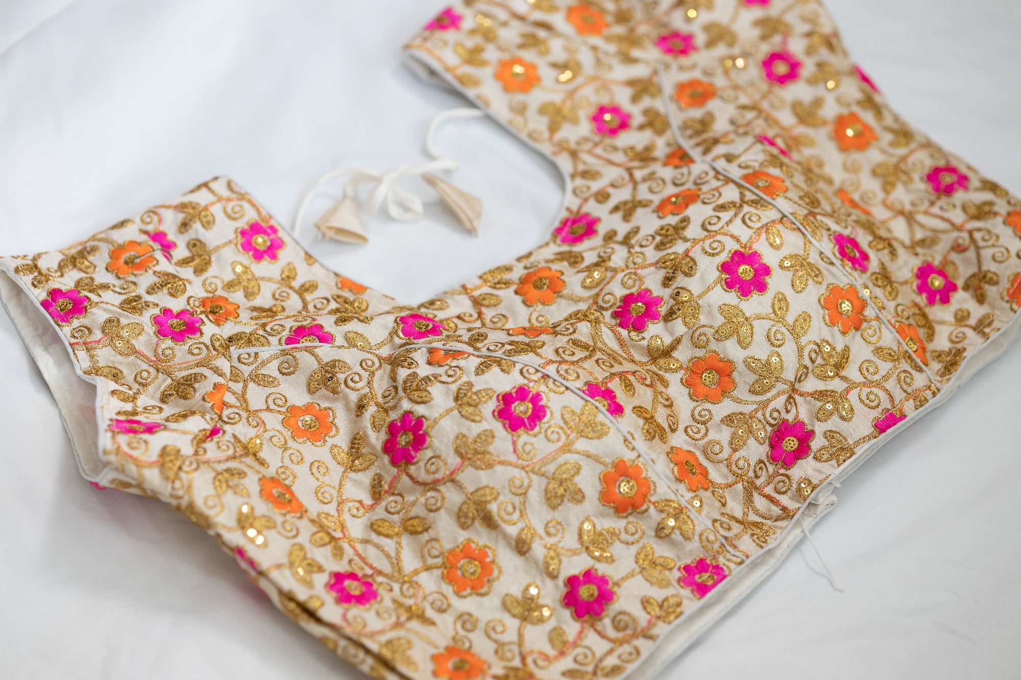 Multi colored stitched party floral blouse