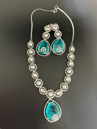 Rosy doublet stone with kundan and pearls necklace set