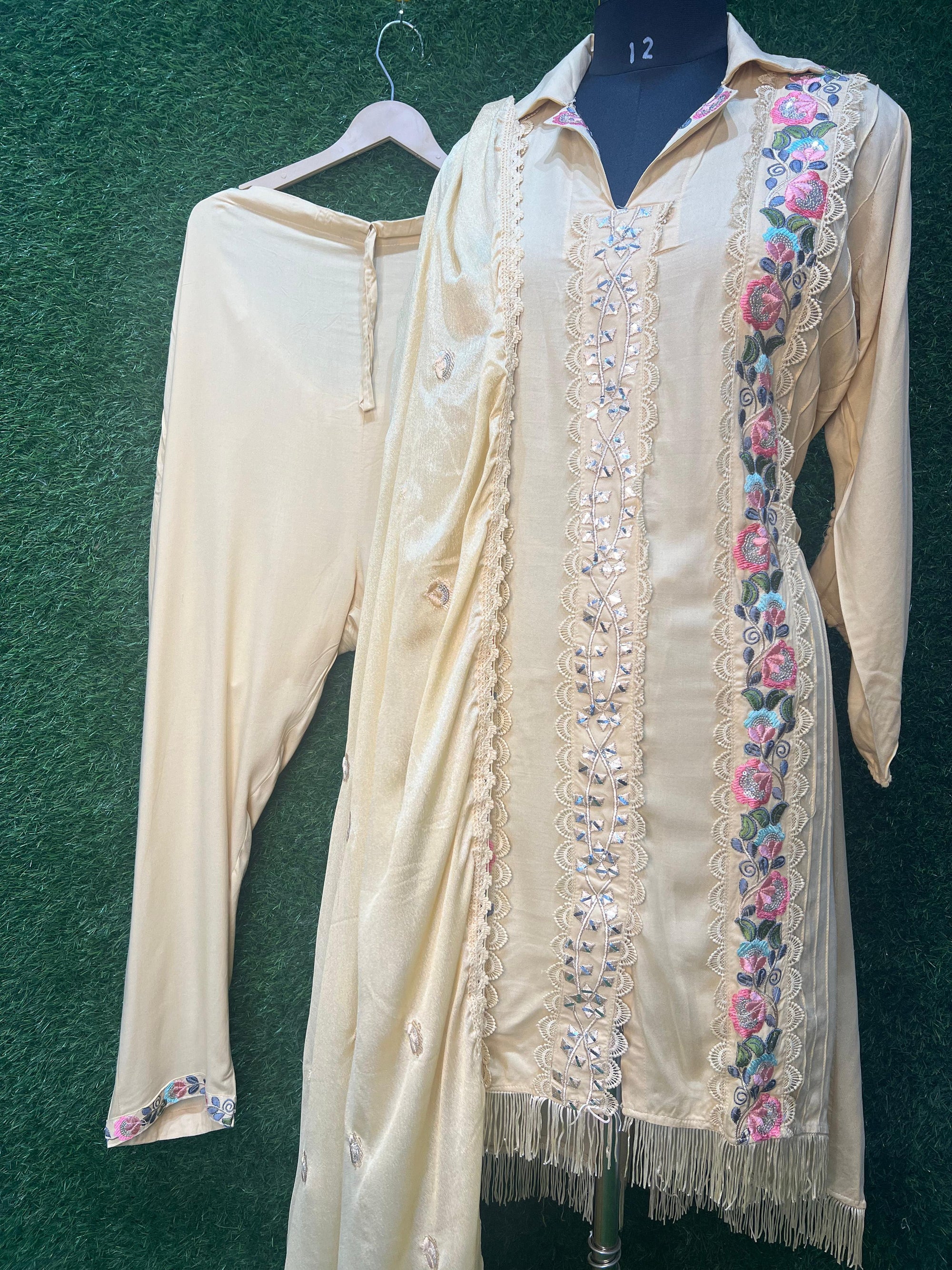 Embroidered suit set. Designed for those who appreciate fine craftsmanship, this ensemble features intricate hand and machine embroidery, adding a touch of luxury to every detail.