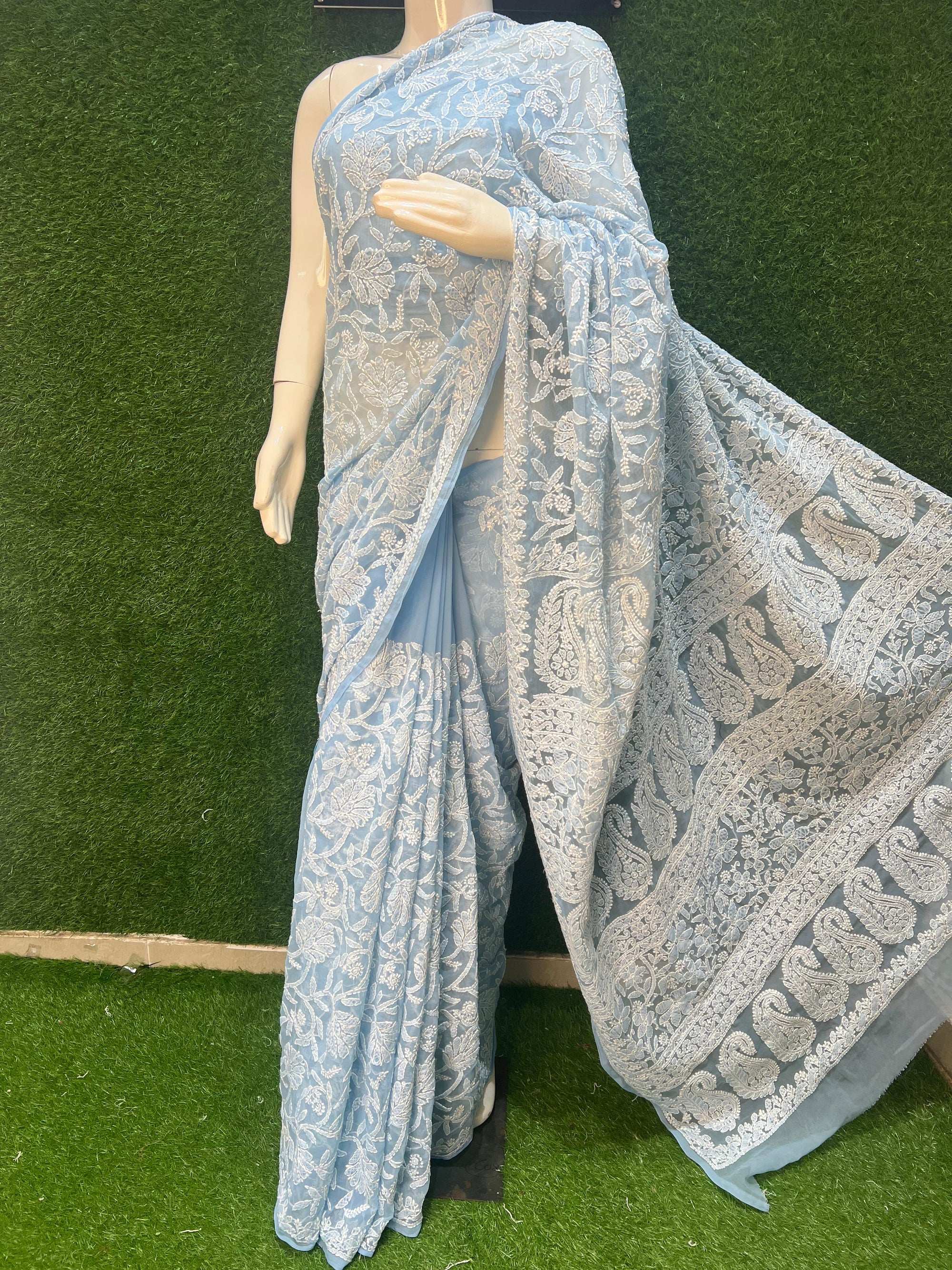 Georgette Lucknowi Chikankari Saree. Crafted from lightweight and flowy georgette fabric, this saree features delicate hand-embroidered Chikankari work, exuding elegance and grace.