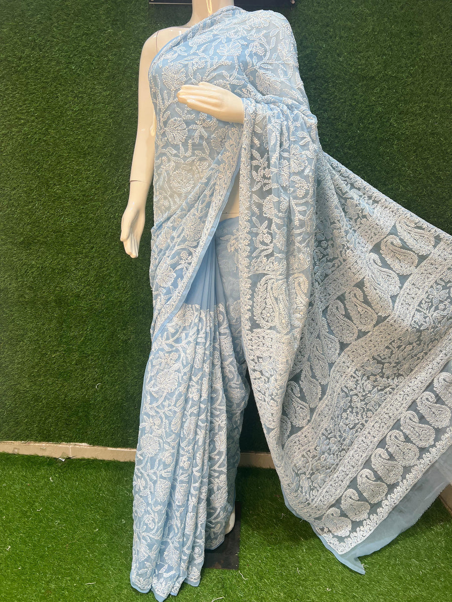  Georgette Lucknowi Chikankari Saree. Crafted from lightweight and flowy georgette fabric, this saree features delicate hand-embroidered Chikankari work, exuding elegance and grace.