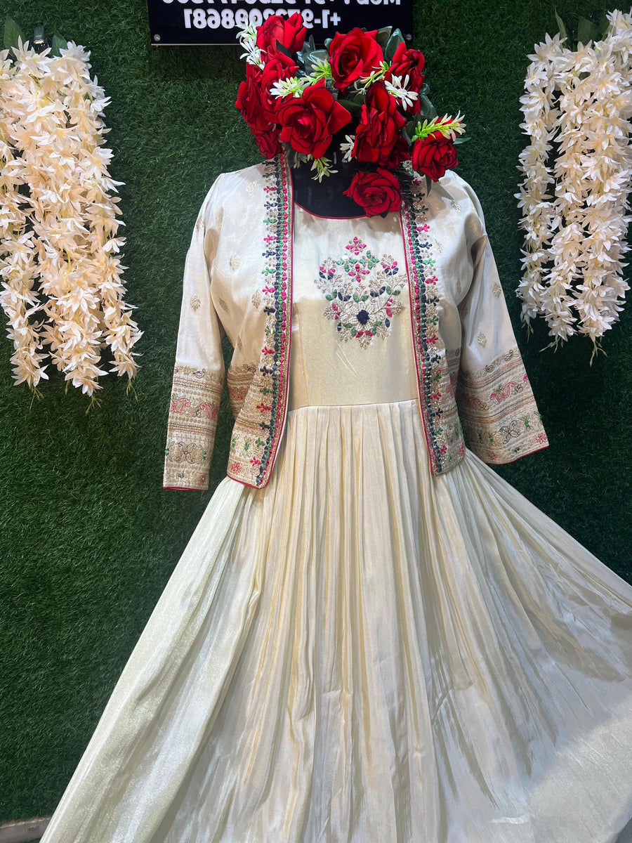 Indulge in sheer sophistication with this off-white designer silk gown, a perfect blend of luxury and grace. Crafted from premium silk fabric, this gown is designed to make a statement at every occasion.